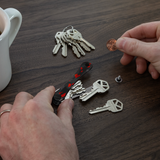 KeySmart Orginal - Compact Key Holder and Keychain Organiser (Up to 8 Keys) - Red Forged Carbon - Side View