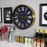 Newgate Mr Butler Wall Clock Radial Brass - Top-Down View