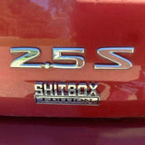 Funny Car Emblem Badge Sticker 8x3cm Metal Self-Adhesive for Rear Boot or Window - Side View