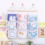 3 Pocket Hanging Storage Bag with Wooden Rod for Wall or Door Organisation - Astronaut - Top-Down View