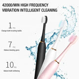 X-3 Sonic Electric Toothbrush, 4 Replacement Brush Heads, and USB Charging Cable - Sleek Pink Design - Front View