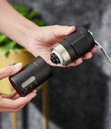 Black Portable Stainless Steel Coffee Grinder - Manual Hand-Cranked Coffee Mill, Heavy-Duty Burr Grinder for Fresh Coffee Beans - Top-Down View