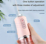 Pink Electric Portable Water Flosser - Smart 4-Head Oral Irrigation Teeth Cleaner, Pulse Cleaning for Home Use - Top-Down View