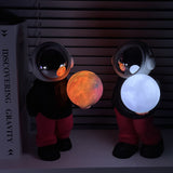 Holding the romantic moon (black top + red pants) Creative Astronaut Bluetooth Speaker with 3D Starry Sky Lighting, Portable Wireless Moon Lamp Speaker - Perfect Gift for Space Enthusiasts - Side View