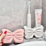 White Creative Ceramic Bowknot Toothbrush Holder - Elegant Bathroom Storage for Electric Toothbrush and Toothpaste - Front View
