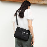 Lightweight Nylon Crossbody Shoulder Bag - Light Blue, Adjustable Strap, Multi-Pocket Design - Top-Down View