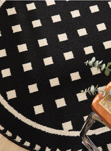 Grunge White Modern Round Area Rug with Geometric Black and White Pattern - Top-Down View