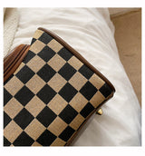 Black Checkered Cosmetic Bag with Handle - Stylish, Compact, and Practical for Travel - Top-Down View