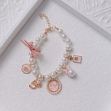 Pink 4-PCS Pearl Charm Pet Necklace - Adjustable Bowknot Collar for Small Dogs & Cats (S: 20+5CM) - Front View