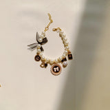 Black 4-PCS Pearl Charm Pet Necklace - Adjustable Bowknot Collar for Small Dogs & Cats (L: 30+5CM) - Front View