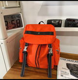 Orange Lightweight Nylon Backpack - Water Resistant Travel Daypack for Women & Men - Front View