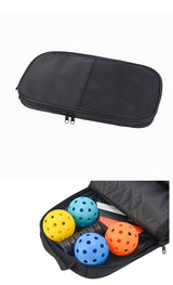 Red Fiberglass Pickleball Paddle Set - 2 Minimalist Paddles, 4 Balls, and Carry Bag for Outdoor Play - Close-Up Angle