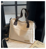 Stylish white canvas tote bag with detachable shoulder strap - Front View