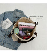 Stylish white canvas tote bag with detachable shoulder strap - Rear View