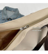 Stylish khaki canvas tote bag with detachable shoulder strap