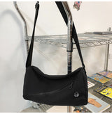An elegant black shoulder bag for travel and work - Front View