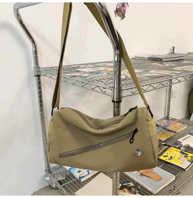 An elegant khaki shoulder bag for travel and work