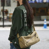 An elegant khaki shoulder bag for travel and work - Side View