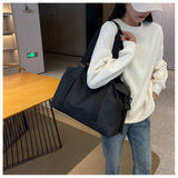 Sleek Black Duffel Bag for Men and Women - Great for Work and Travel - Front View