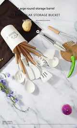 White 11-Piece Silicone Kitchen Utensil Set with Wooden Handles and Storage Bucket - Heat Resistant and Non-Stick - Close-Up Angle