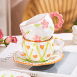 Hand-Painted Ceramic Coffee Mug and Saucer Set - Whimsical Afternoon Tea Cup with Spoon(Smiley pink flower) - Front View
