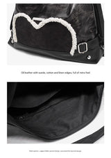 Stylish black tote backpack with heart embellishment - can be worn on one shoulder or as a backpack - Rear View