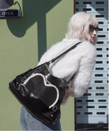 Stylish black tote backpack with heart embellishment - can be worn on one shoulder or as a backpack - Low Angle