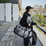 Grey Unisex Travel Bag with Utility Buckles and Wet/Dry Compartments - Front View