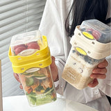 Yellow Portable salad cup with ingredient compartment and fork and spoon - enjoy breakfast on the go - Front View