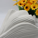 White Elegant Off-White Ceramic Vase - Modern Sculptural Flower Holder with Wide Fluted Opening - Close-Up Angle