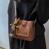 Vintage Style PU Leather Bucket Bag with Wide Patterned Strap & Optional Bunny Charm(black) - Front View