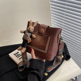 Vintage Style PU Leather Bucket Bag with Wide Patterned Strap & Optional Bunny Charm(black) - 45-Degree Angle