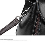 Black Elegant Women's PU Leather Top Handle Satchel - Versatile Crossbody Bag with Classic Clasp & Braided Detail - Low Angle