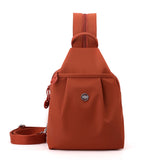 Orange Versatile Women's Convertible Mini Backpack & Sling Bag - Stylish Anti-Theft Oxford Cloth Daypack, Fits 9.7in iPad