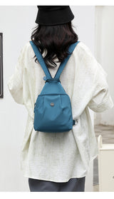 Blue Versatile Women's Convertible Mini Backpack & Sling Bag - Stylish Anti-Theft Oxford Cloth Daypack, Fits 9.7in iPad - Front View