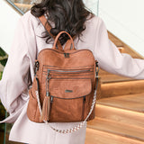 Brown Chic Women's PU Leather Convertible Backpack - Anti-Theft Design, Multi-Pocket Shoulder Bag with Tassel - Low Angle
