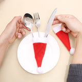 Mini Santa Hat Cutlery Holders (100-Pack) - Festive Christmas Wine Bottle Toppers & Table Decorations - Side View