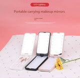 2-Piece Black Portable LED Makeup Mirror with Brush - Foldable, Rotatable, and Rechargeable Travel Vanity Mirror - Front View
