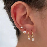 Four-piece set Gold Delicate CZ Earring Stacking Set - Huggie Hoops & Studs for Multiple Piercings - Front View
