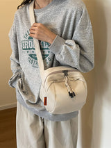 White Lightweight Canvas Crossbody Bag - Minimalist Casual Shoulder Satchel with Adjustable Strap - Low Angle