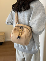 Khaki Lightweight Canvas Crossbody Bag - Minimalist Casual Shoulder Satchel with Adjustable Strap - Close-Up Angle