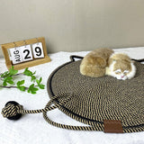 Black and Brown Durable Cat Scratching Mat with Attached Toy Ball - Washable and Multi-Functional, Ideal for Cats' Scratching and Sleeping - 50cm Diameter - Side View