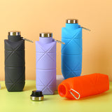 Orange-red 700ml Collapsible Silicone Water Bottle with Diamond Pattern - Food-Grade Portable Sports Bottle for Hiking, Camping, Travel & Gym - Leak-Proof Foldable Design with Carabiner Clip - Side View