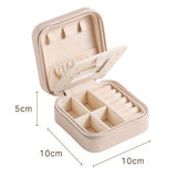Grey Mini Travel Jewelry Box with Mirror - 10x10x5cm Portable PU Leather Organizer for Rings, Earrings, Necklaces, Anti-Tarnish Velvet Interior, Compact Design for On-the-Go Storage - Top-Down View