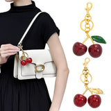 Golden Fashionable Cherry Keychain with Fruit Pendant for Handbags and Keys Stylish Accessory Solution for Local Trendsetters - Top-Down View