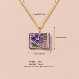 Vintage-style book necklace with February birthday flowers, a luxurious gold-plated bronze exquisite floral pendant gift - Top-Down View