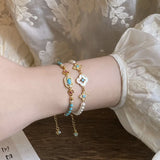 2PCS Vintage Layered Pearl Bracelet Set | Elegant Zircon Flower Charm Gold Plated Stackable Bracelets Jewelry Gift - Top-Down View