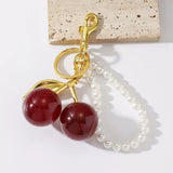 Cute Cherry Bag Charm Keychain with Faux Pearl Strap - Creative Resin Red Cherry Pendant Key Ring Accessory for Women’s Handbags, Purses & Backpacks - Front View