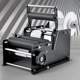 VEVOR Manual Round Labeling Machine, 15-20pcs/min, Bottle Label Applicator for Round Bottles, Adjustable Manual Round Bottle Labeler Suitable for Round Bottle Diameter 20-120 mm (with Pressing Bar) - Low Angle