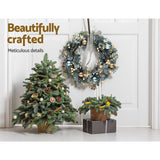 Delightful 60cm LED Christmas Wreath with Snowy Garland and Ornaments - Close-Up Angle
